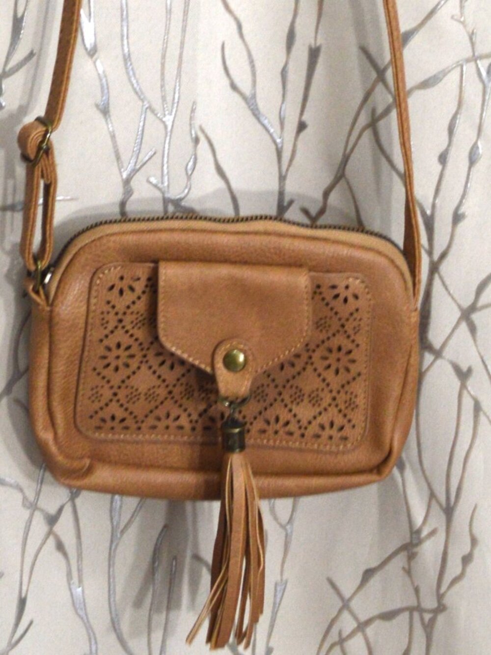 Crossbody Bag with Perforated Design and Tassel – Good Condition